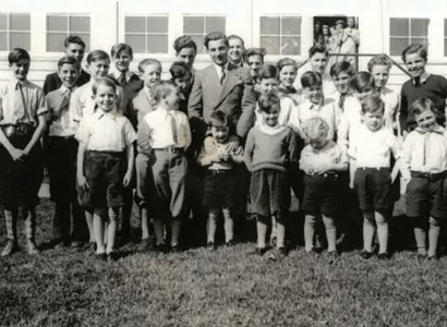 Large group of children standing outside the Children's Home circa 1950